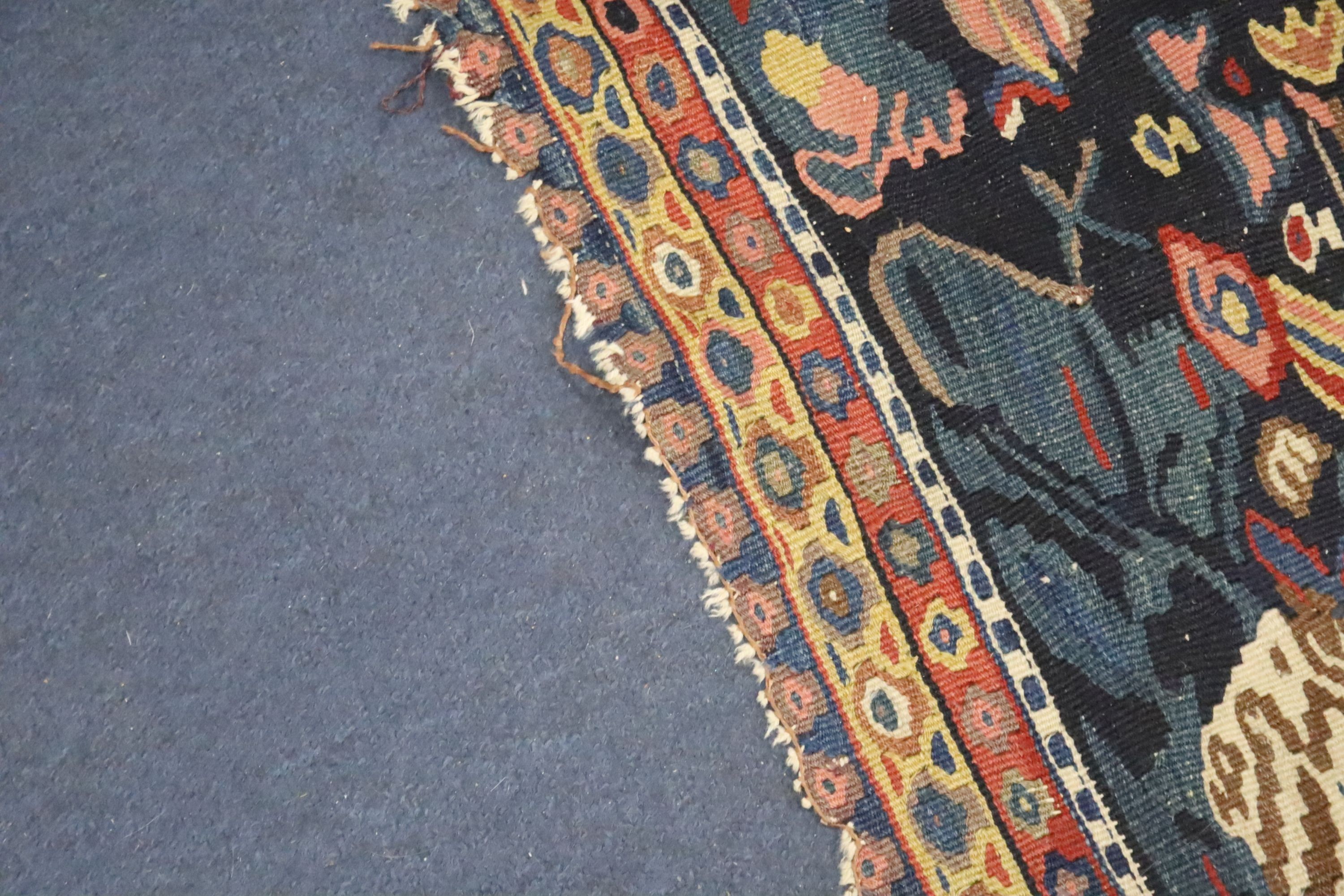 A late 19th century / early 20th century Senneh polychrome Kilim rug, 190 x 130cm